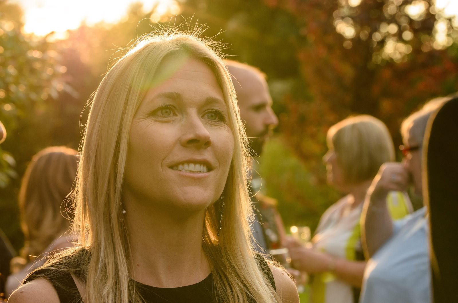 Golden-hour wide shot, outdoor event
